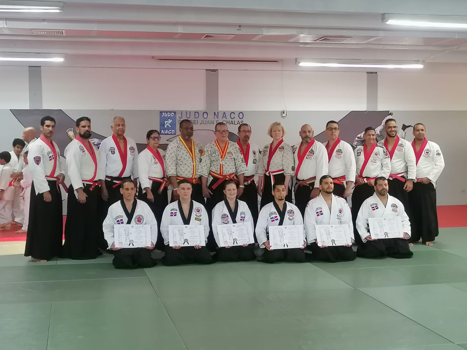 Black belt practitioners with certificates